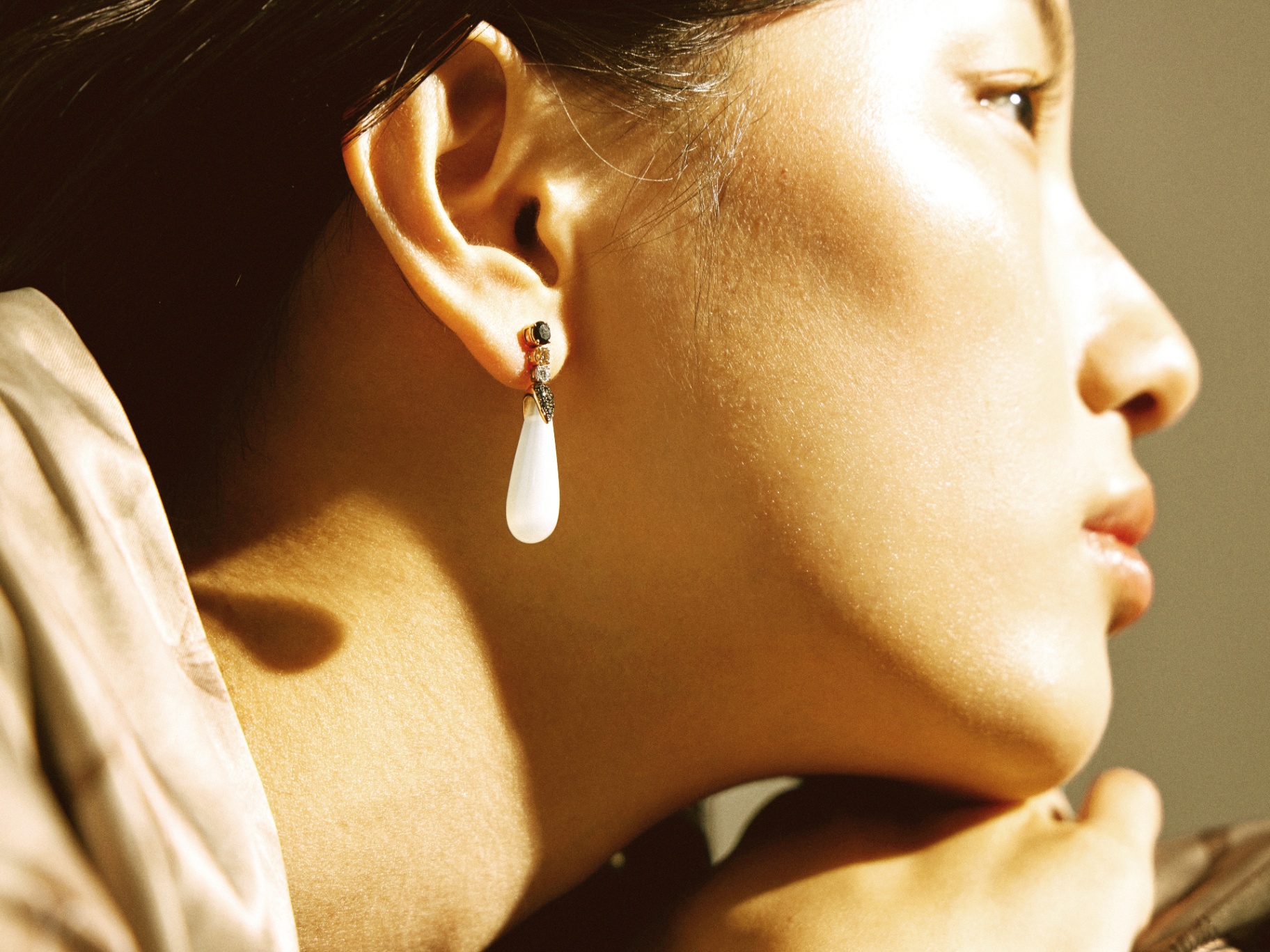 Side profile portrait of a woman in warm sunlight